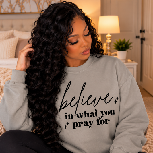 Model wearing Believe In What You Pray For faith sweatshirt by Wear Your Truth Attire